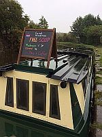nb 10000 Reasons on the soup run mooring with a chalk board on the roof advertising free soup.